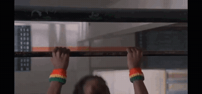 Person Hanging Upside Down On Bar GIF
