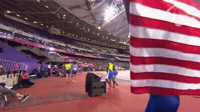 Person Holding American Flag In Stadium Saying The New GIF
