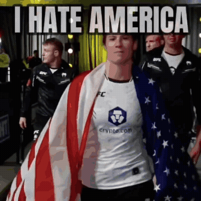Person Holding American Flag Saying I Hate America GIF