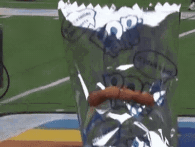 Person Holding Bag Of Pop Tarts On Field GIF