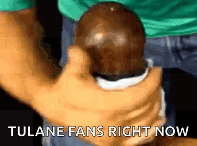 Person Holding Ball Saying Tulane Fans Right Now GIF