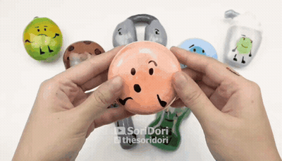 Person Holding Ball With Face GIF