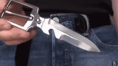 Person Holding Belt Buckle With Knife GIF