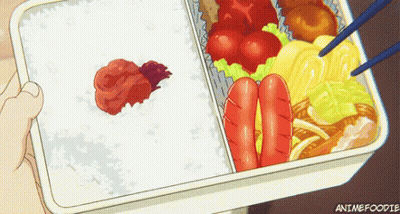 Person Holding Bento Box With Rice Sausages Vegetables GIF