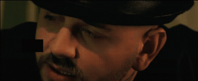 Person Holding Bird Statue With Play Button GIF