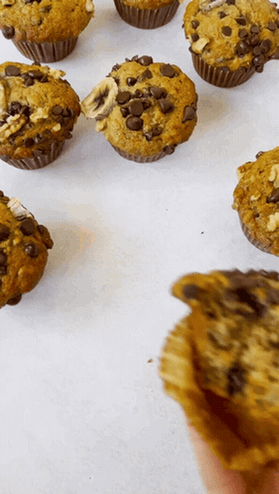 Person Holding Bitten Muffin