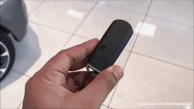 Person Holding Black Car Key GIF