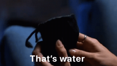Person Holding Blue Bottle Saying That's Water GIF
