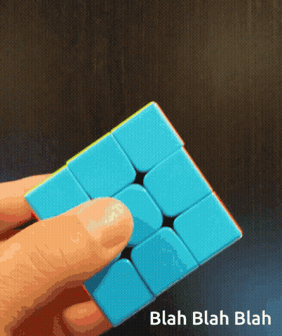 Person Holding Blue Cube Saying Blah Blah Blah GIF