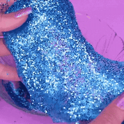 Person Holding Blue Glitter Slime GIF