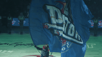 Person Holding Blue Pistons Flag GIF