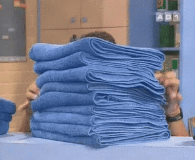 Person Holding Blue Towels GIF