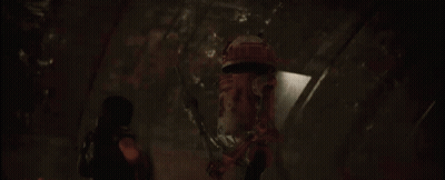 Person Holding Bomb In Dark Room GIF