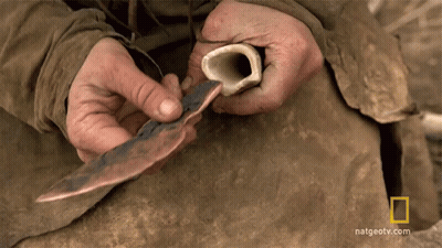 Person Holding Bone And Knife GIF
