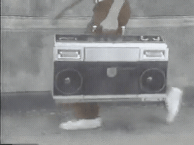 Person Holding Boombox On Sidewalk GIF