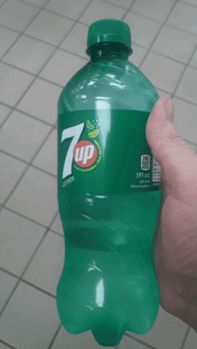 Person Holding Bottle Of 7Up GIF