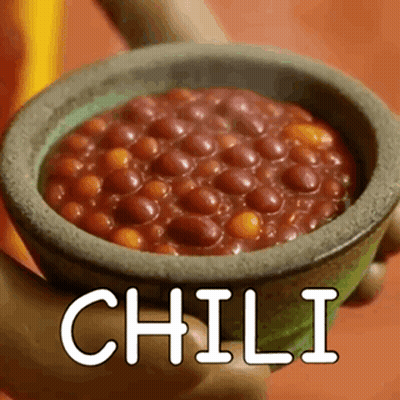 Person Holding Bowl of Chili