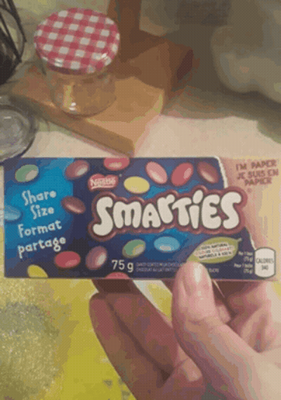 Person Holding Box Of Smarties Candy GIF