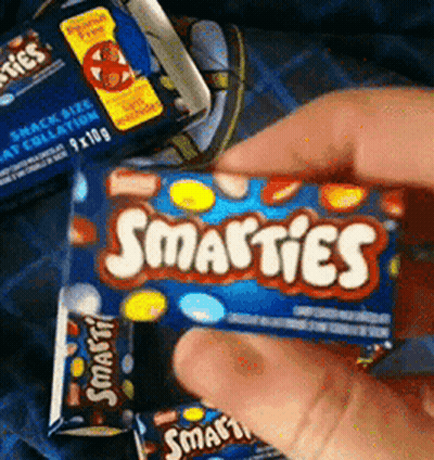 Person Holding Box Of Smarties Candy GIF