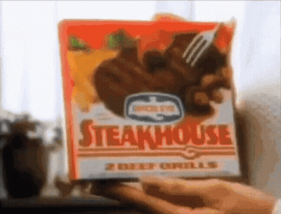 Person Holding Box Of Steakhouse Beef Grills With Fork GIF