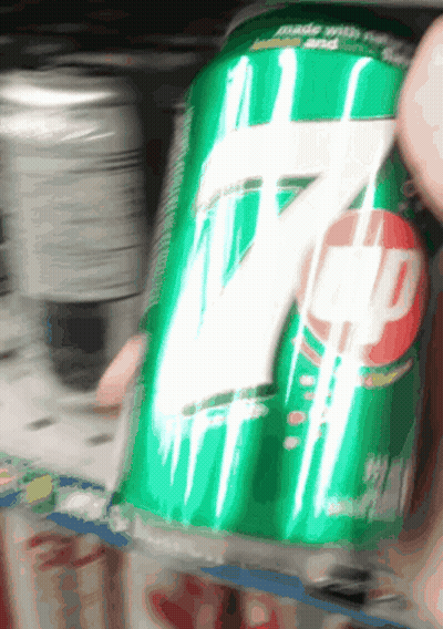 Person Holding Can Of 7 Up GIF