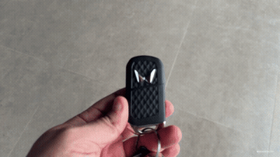 Person Holding Car Key With Letter M GIF