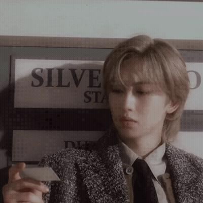 Person Holding Card Near Sign Saying Silve GIF