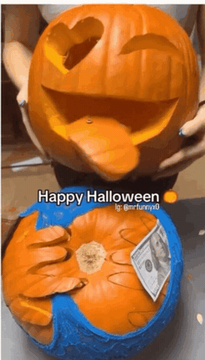Person Holding Carved Pumpkin Saying Happy Halloween GIF