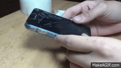 Person Holding Cell Phone With Broken Screen GIF