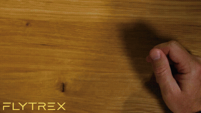 Person Holding Cell Phone With Flytrex Logo GIF