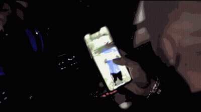 Person Holding Cell Phone With Man On Screen GIF