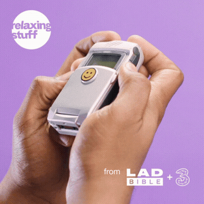 Person Holding Cell Phone With Smiley Face In Front Of Relaxing Stuff Logo GIF