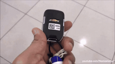 Person Holding Chevrolet Remote With QR Code GIF