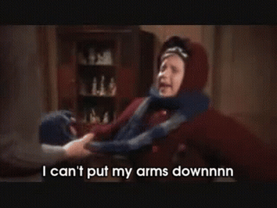 Person Holding Child's Arm Saying I Can't Put My Arms Downnnn GIF
