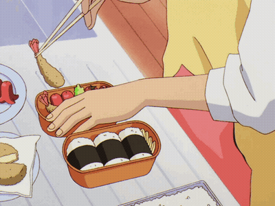 Person Holding Chopsticks Over Bento Box GIF