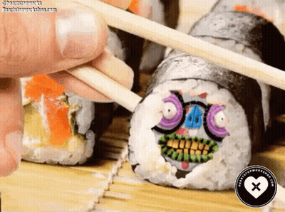 Person Holding Chopsticks Over Sushi With Face GIF