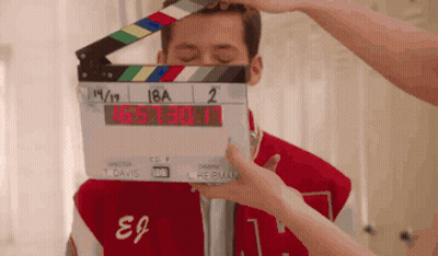 Person Holding Clapper Board 18A 2 GIF