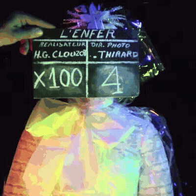 Person Holding Clapper Board Saying L' Enfer GIF
