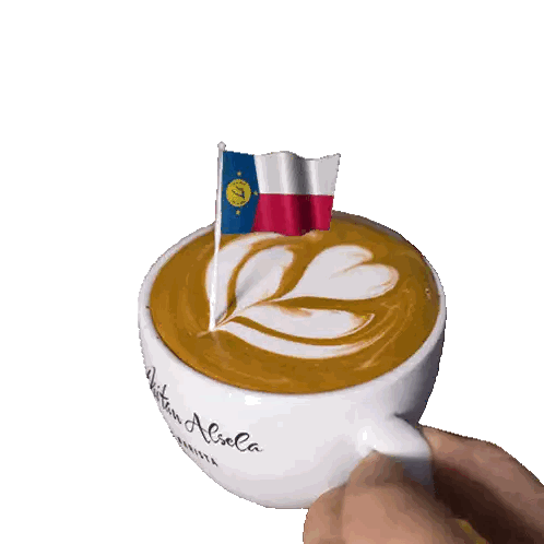 Person Holding Coffee Cup With Flag Sticker