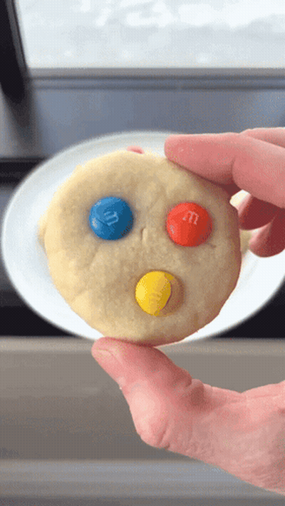 Person Holding Cookie With M&M's GIF