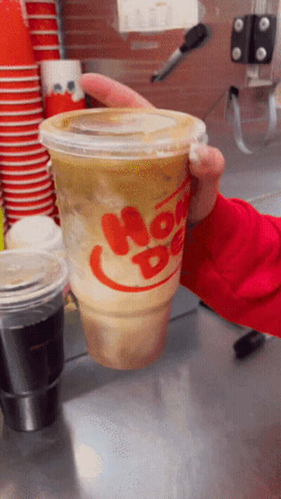 Person Holding Cup Of Hot Dog GIF