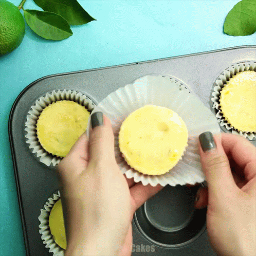 Person Holding Cupcake In Muffin Tin Saying Cakes GIF