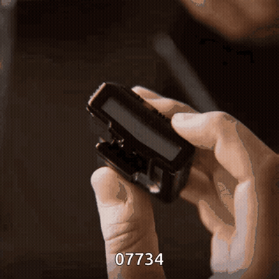 Person Holding Device With Number 07734 GIF