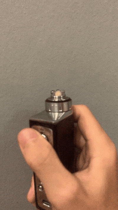Person Holding Device With Smoke GIF