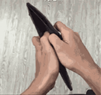 Person Holding Empty Black Wallet GIF