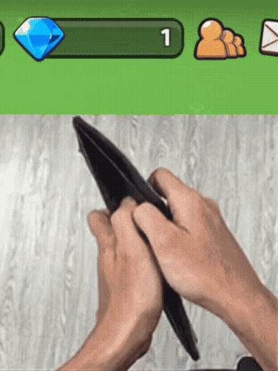 Person Holding Empty Wallet In Front Of Green Bar Number 1 GIF