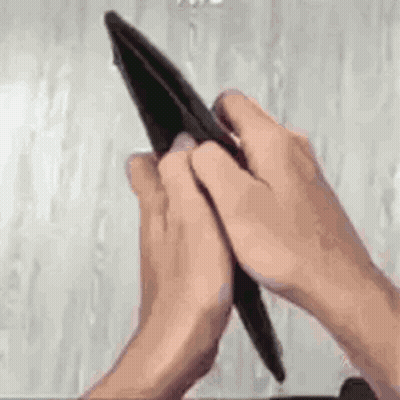 Person Holding Empty Wallet Looking At It GIF