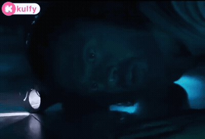 Person Holding Flashlight In Dark Room GIF