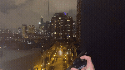 Person Holding Flashlight With Chicago Lanyard GIF