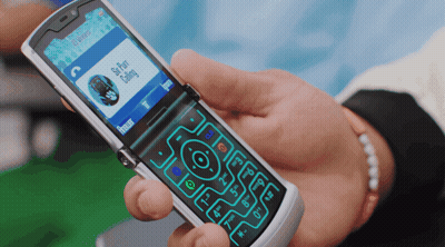 Person Holding Flip Phone With Skype Chat Calling GIF